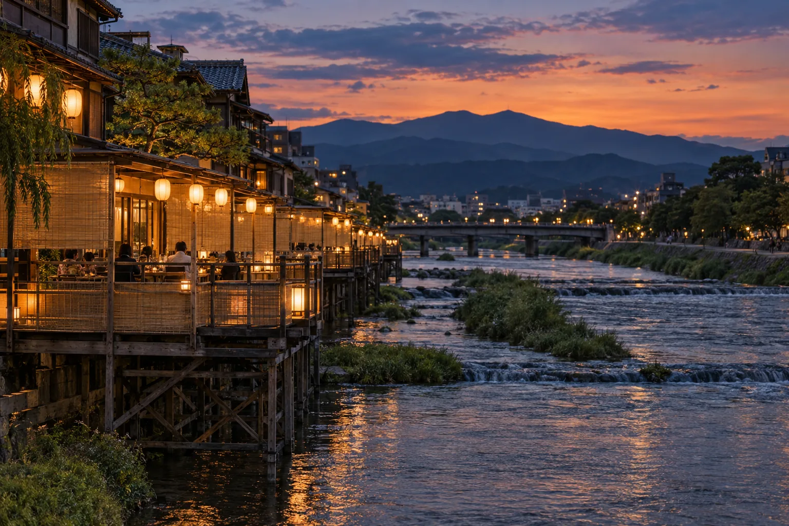 Wooden riverside dining platforms along the Kamo River at dusk in summer