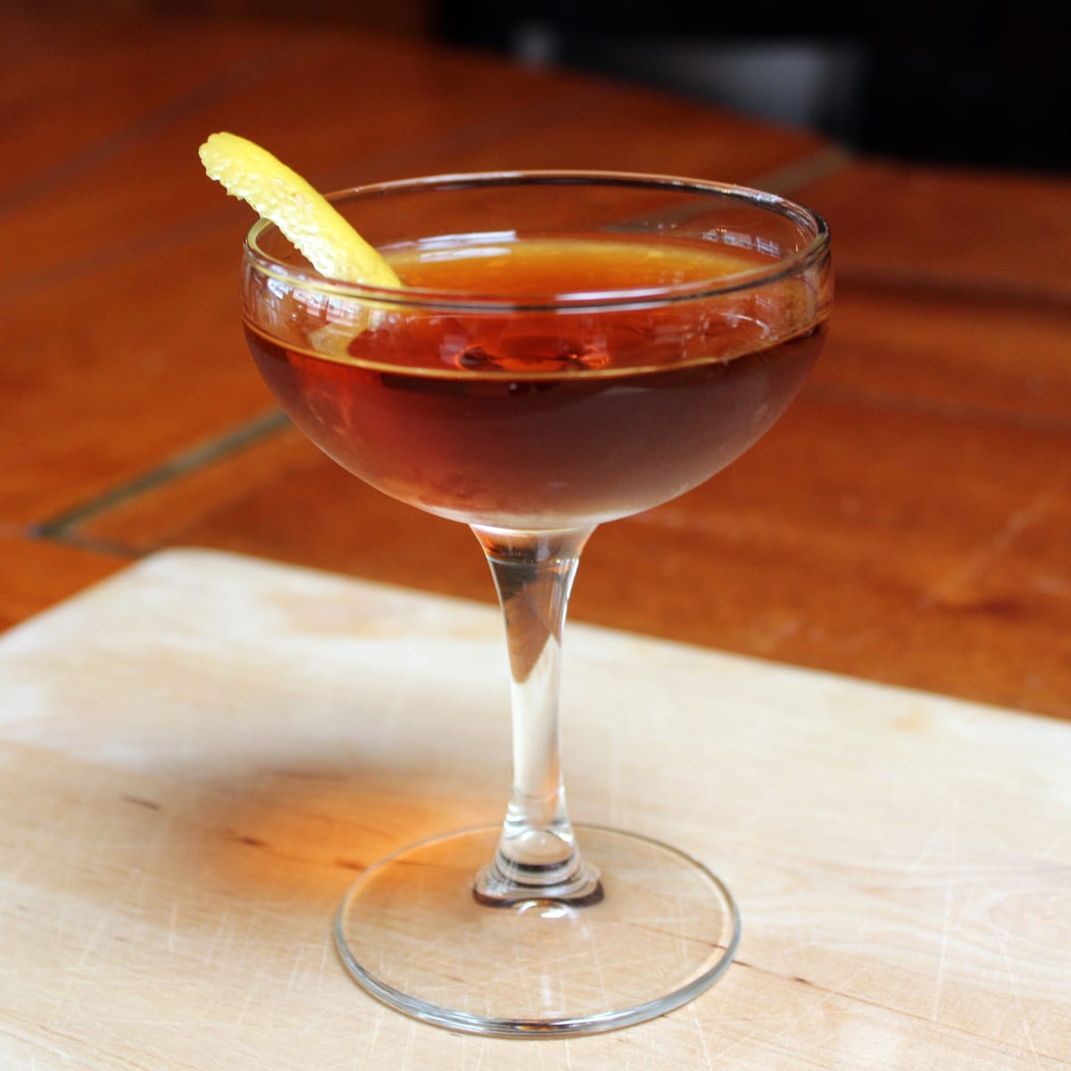 A Martinez cocktail with a lemon twist